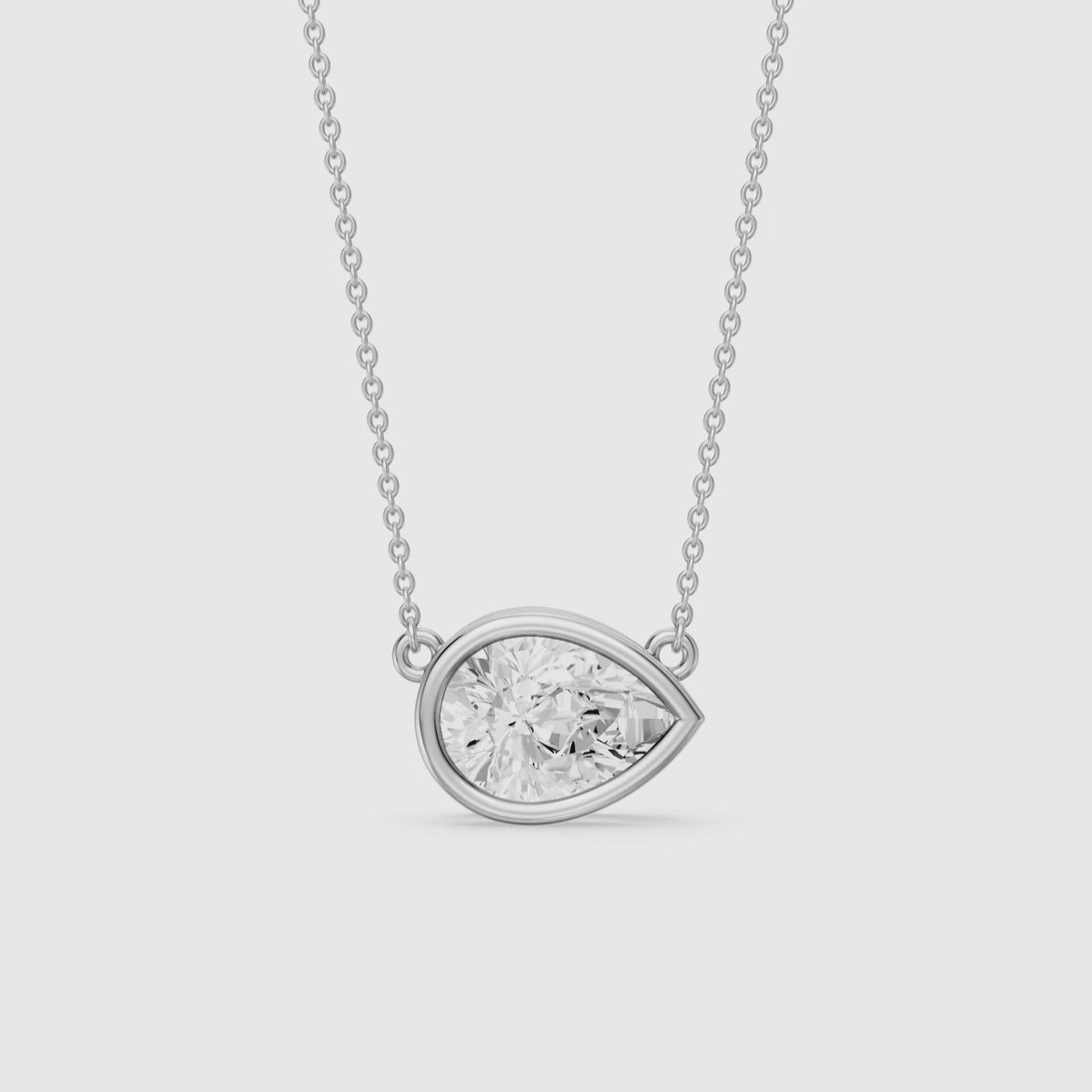Load video: Sydney East West Pear Shape Lab Grown Diamond Bezel Pendant