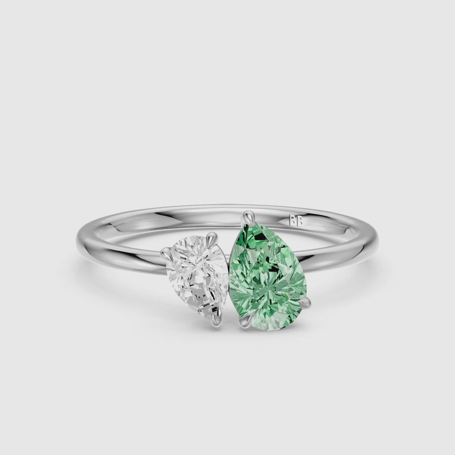 Load video: Irina Green and White Graduated Pear Shape Color Lab Grown Diamond Toi et Moi Ring
