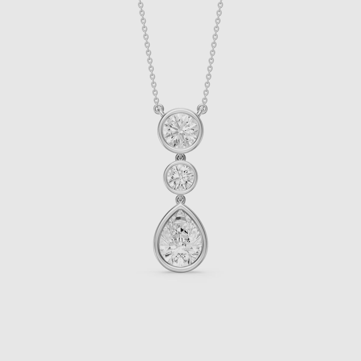 Load video: Anya Pear Shape and Round Bezel Drop Lab Grown Diamond Pendant