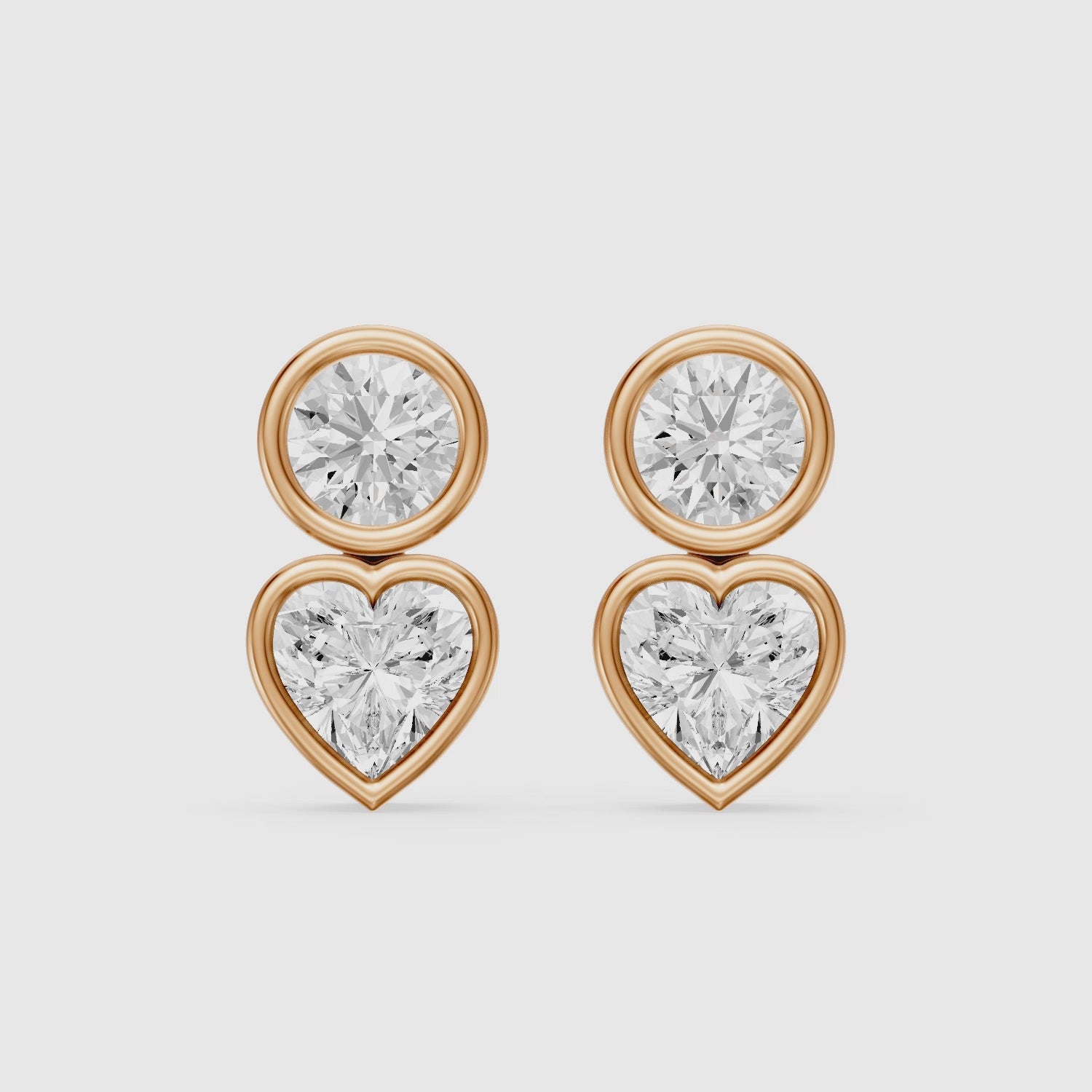 Load video: Veda Heart and Round Lab Grown Diamond Bezel Stud Earrings