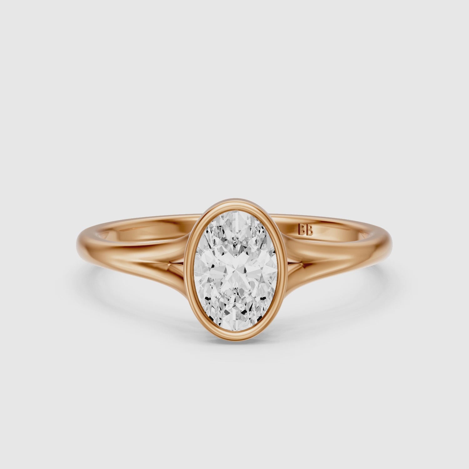 Load video: Ember Oval Cut Lab Grown Diamond Ring in Bezel Set Split Shank Style