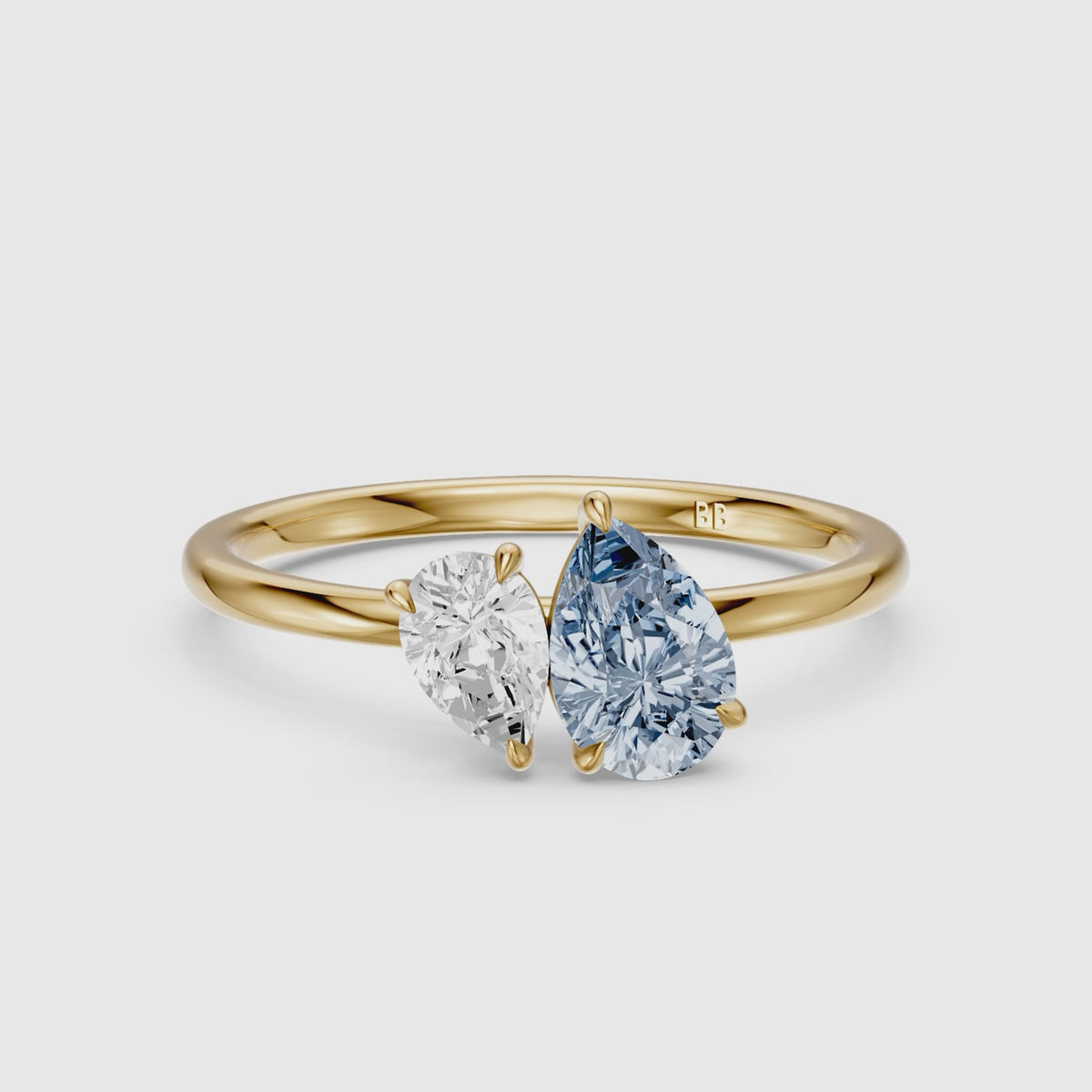 Load video: Livia Blue and White Graduated Pear Shape Color Lab Grown Diamond Toi et Moi Ring
