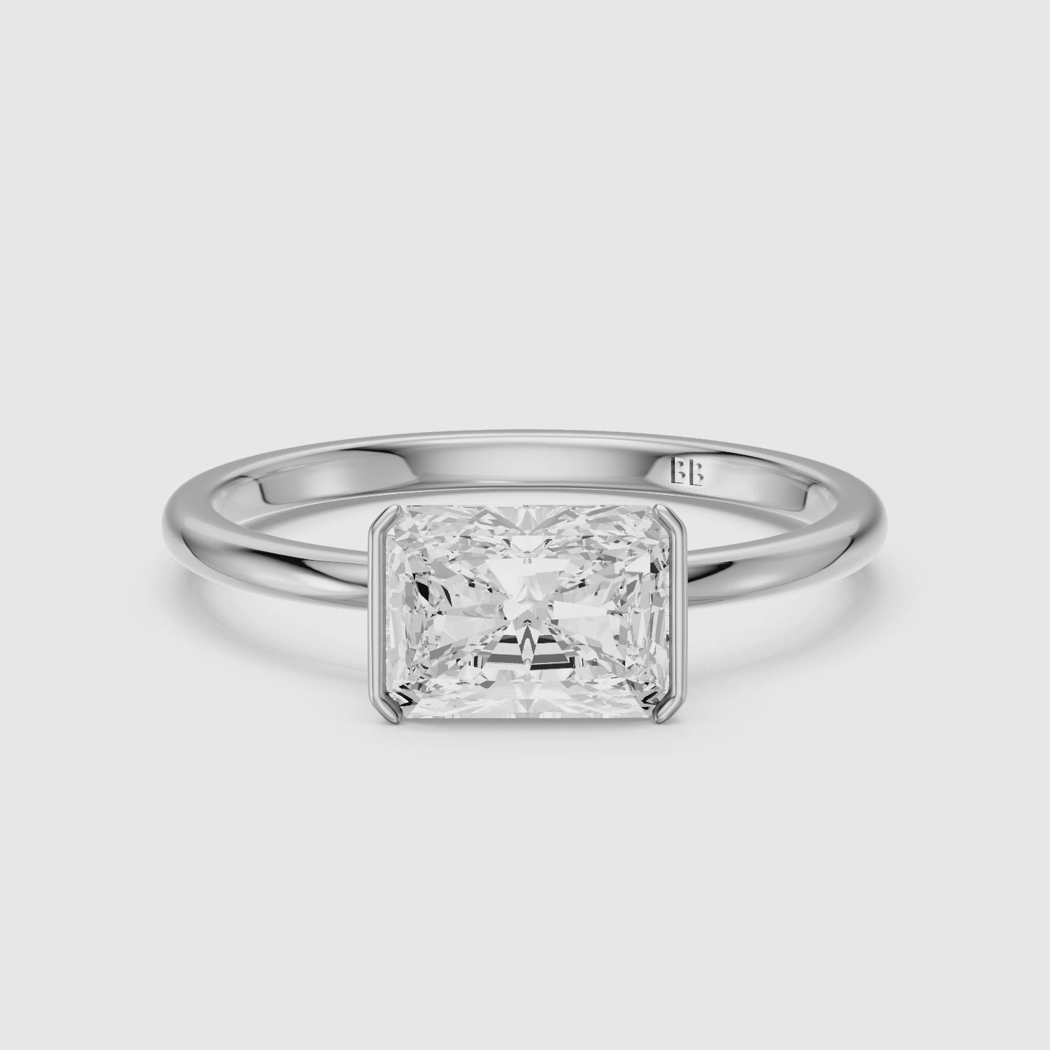 Load video: Penelope Radiant Cut East West Half Bezel Moissanite Diamond Ring