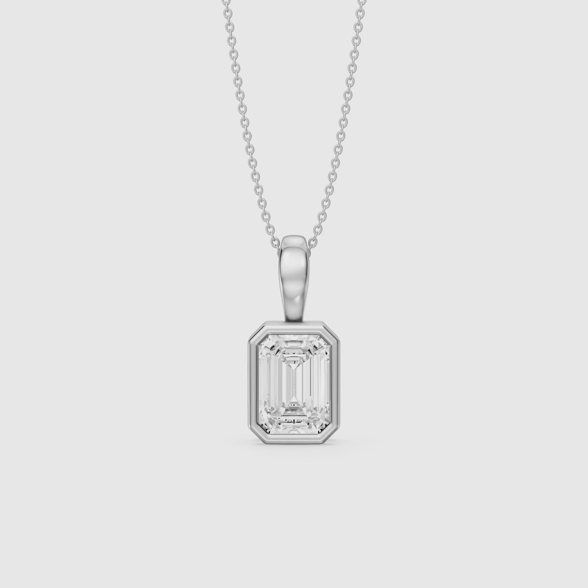 Load video: Lisa Emerald Bezel Set Lab Grown Diamond Solitaire Pendant