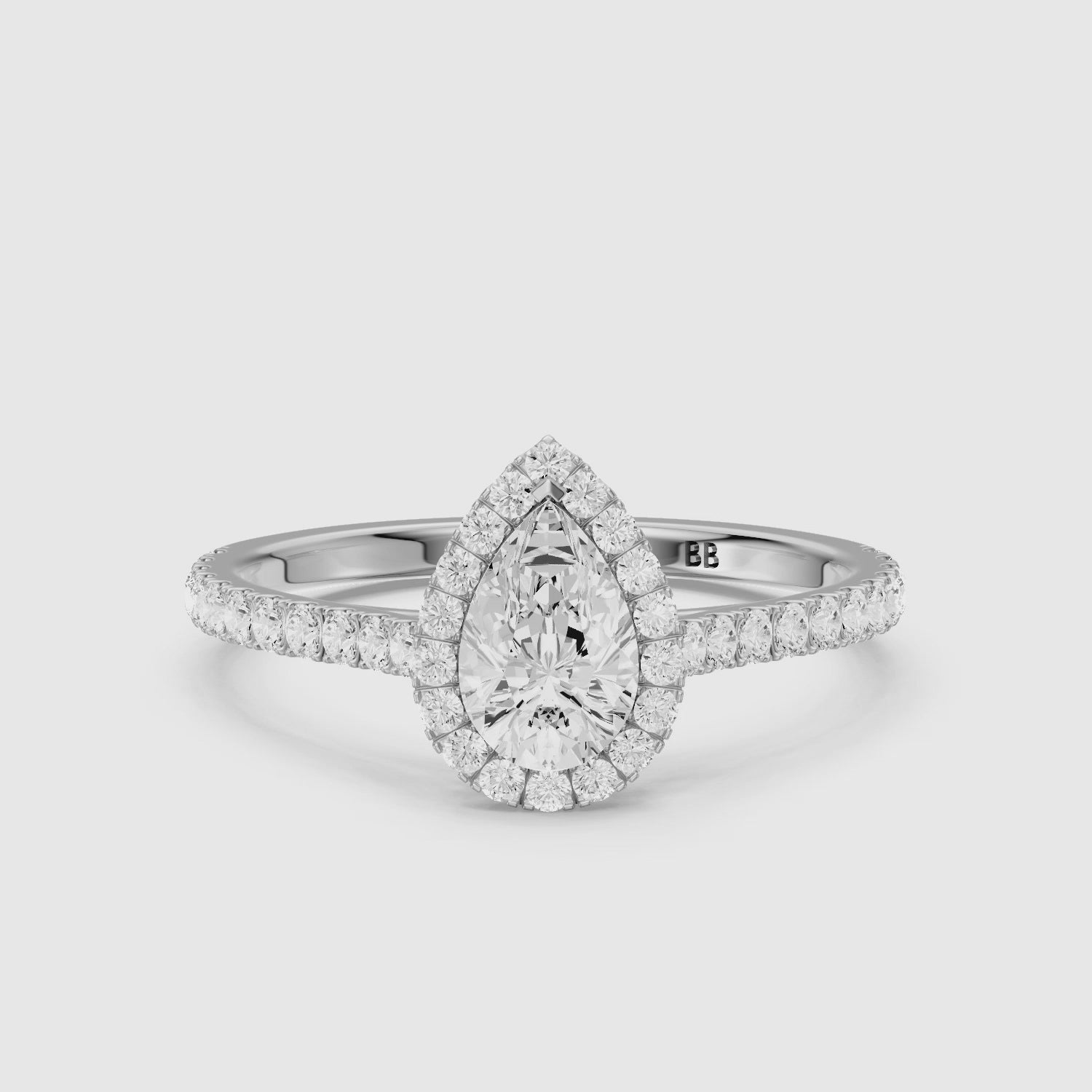 Load video: Joelle Pear Cut Halo Pave Side Stone Lab Grown Engagement Ring